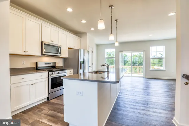 a kitchen with a sink and window