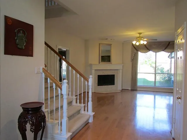 a view of an entryway with wooden floor