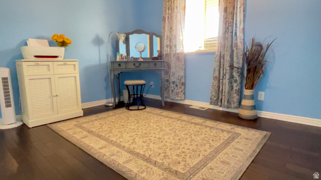 1797 Sunset Road Enoch, UT 84721 - Photo 27 of 80 Dark wood-finish flooring with light blue wall paint