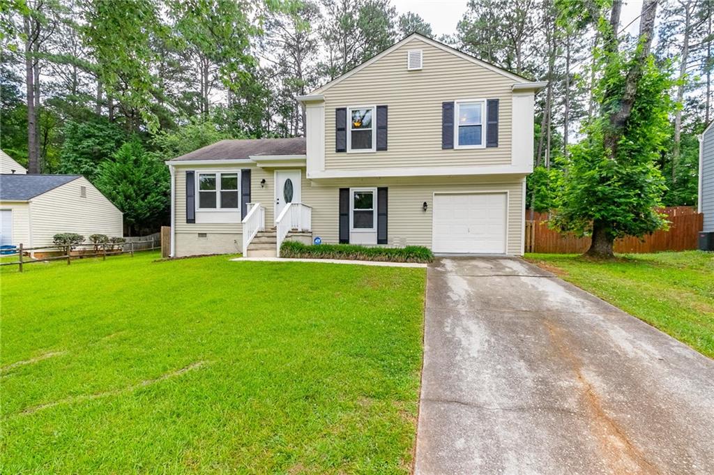 10275 Rillridge Court Alpharetta, GA 30022 - Photo 1 of 1 a front view of a house with a yard and porch