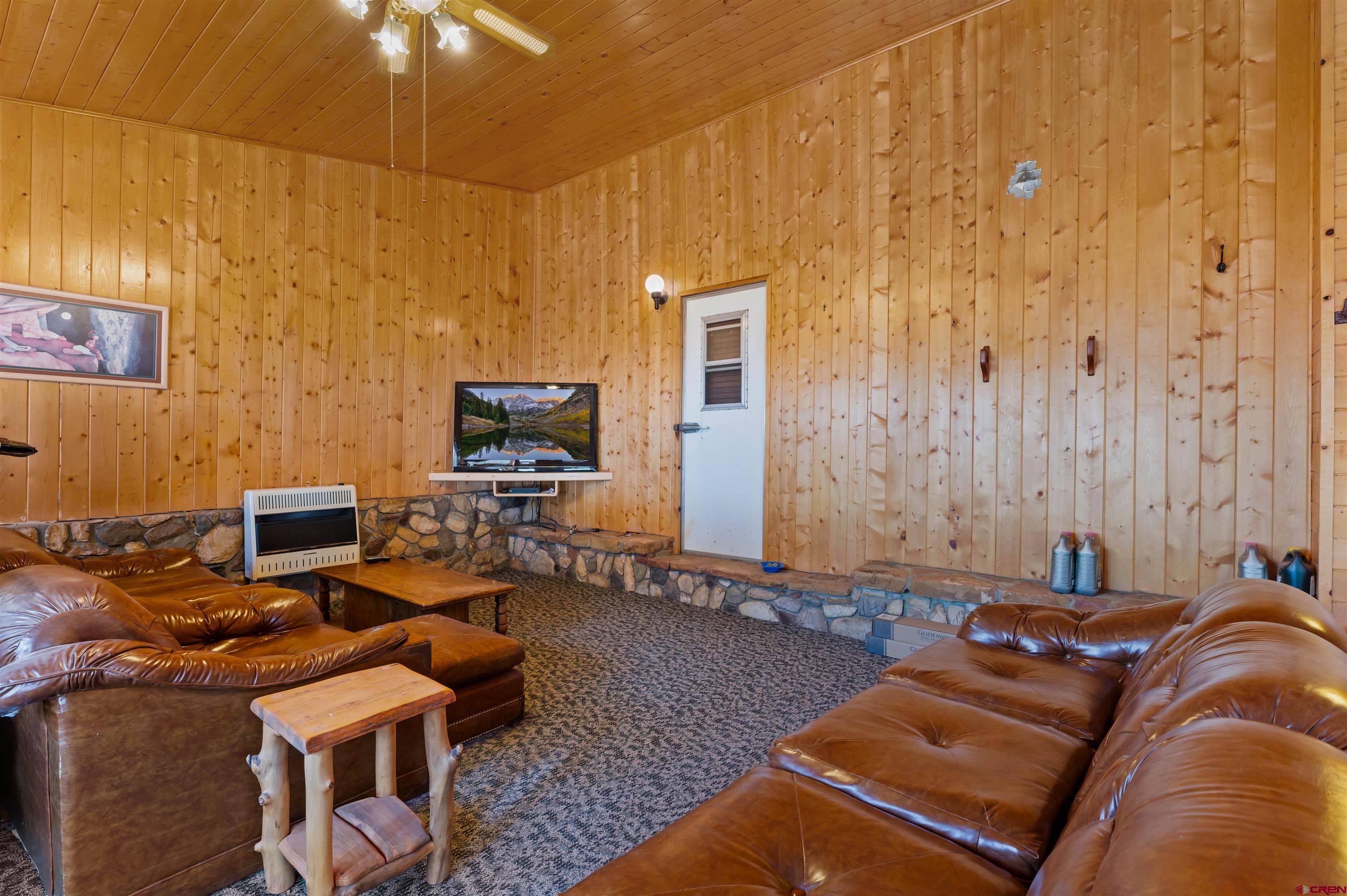 106 County Road 106 Hesperus, CO 81326 - Photo 33 of 44 a living room with furniture and a flat screen tv