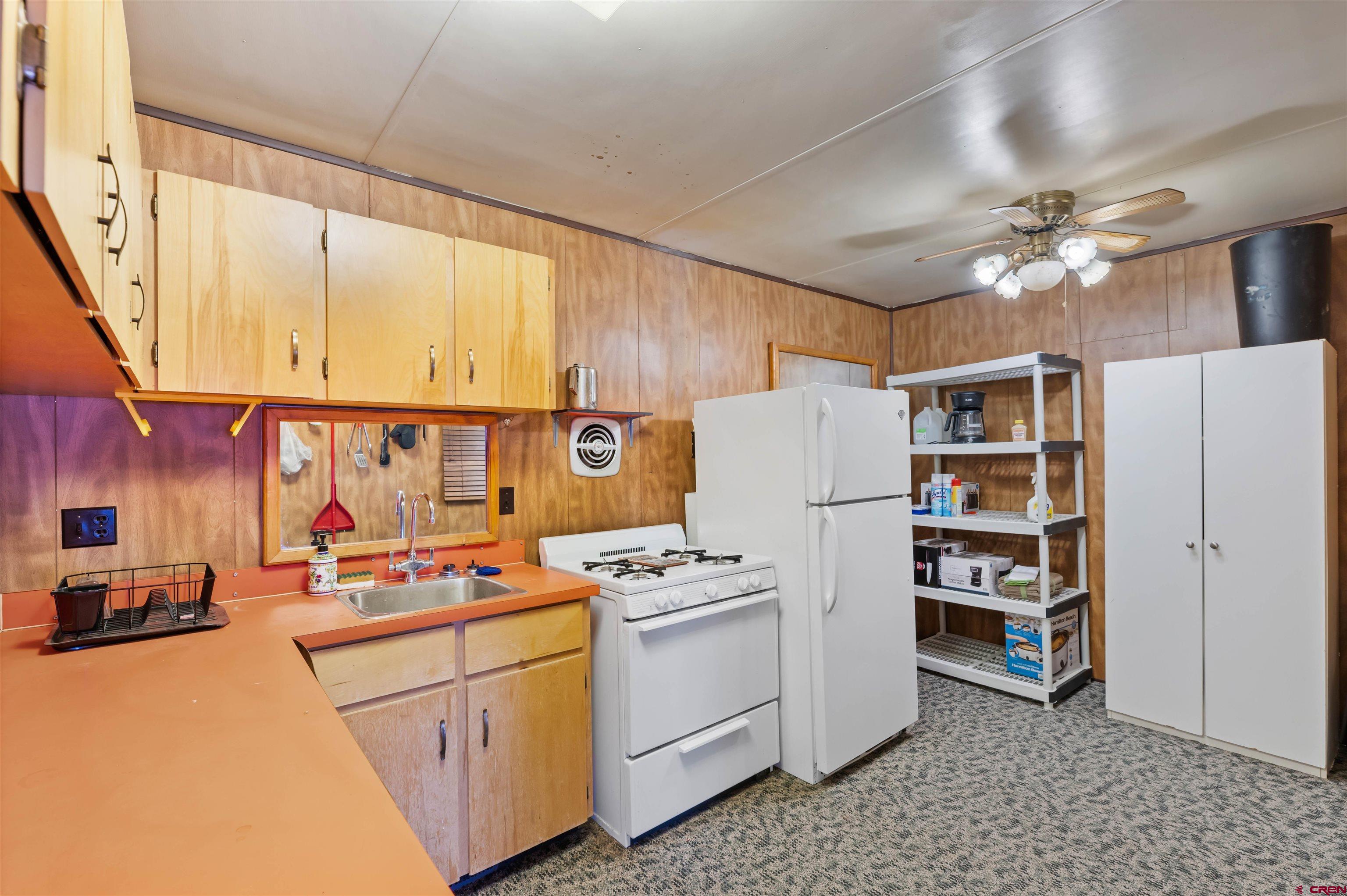 106 County Road 106 Hesperus, CO 81326 - Photo 36 of 44 a kitchen with refrigerator cabinets and window
