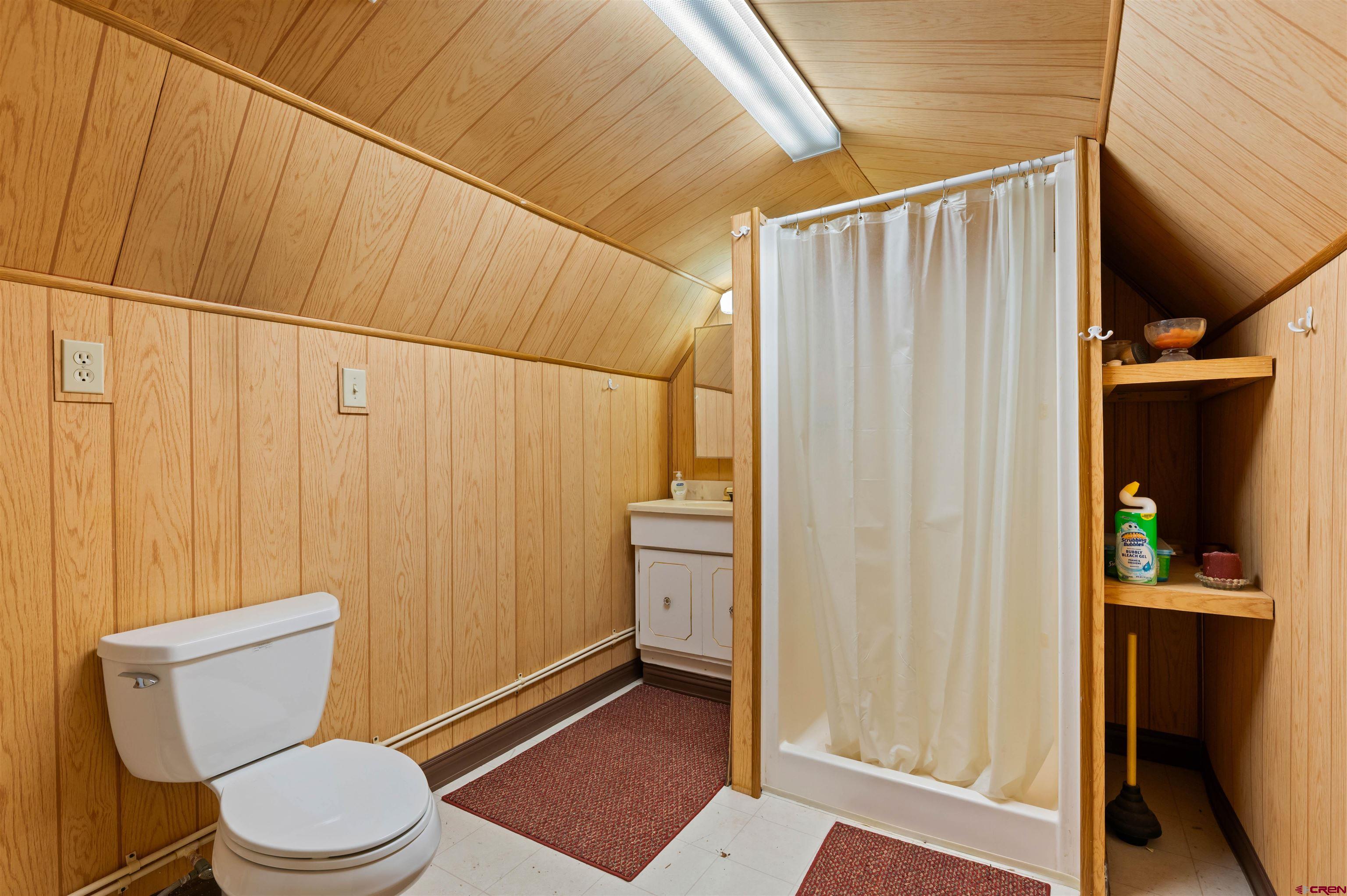 106 County Road 106 Hesperus, CO 81326 - Photo 40 of 44 a white toilet sitting next to a shower curtain