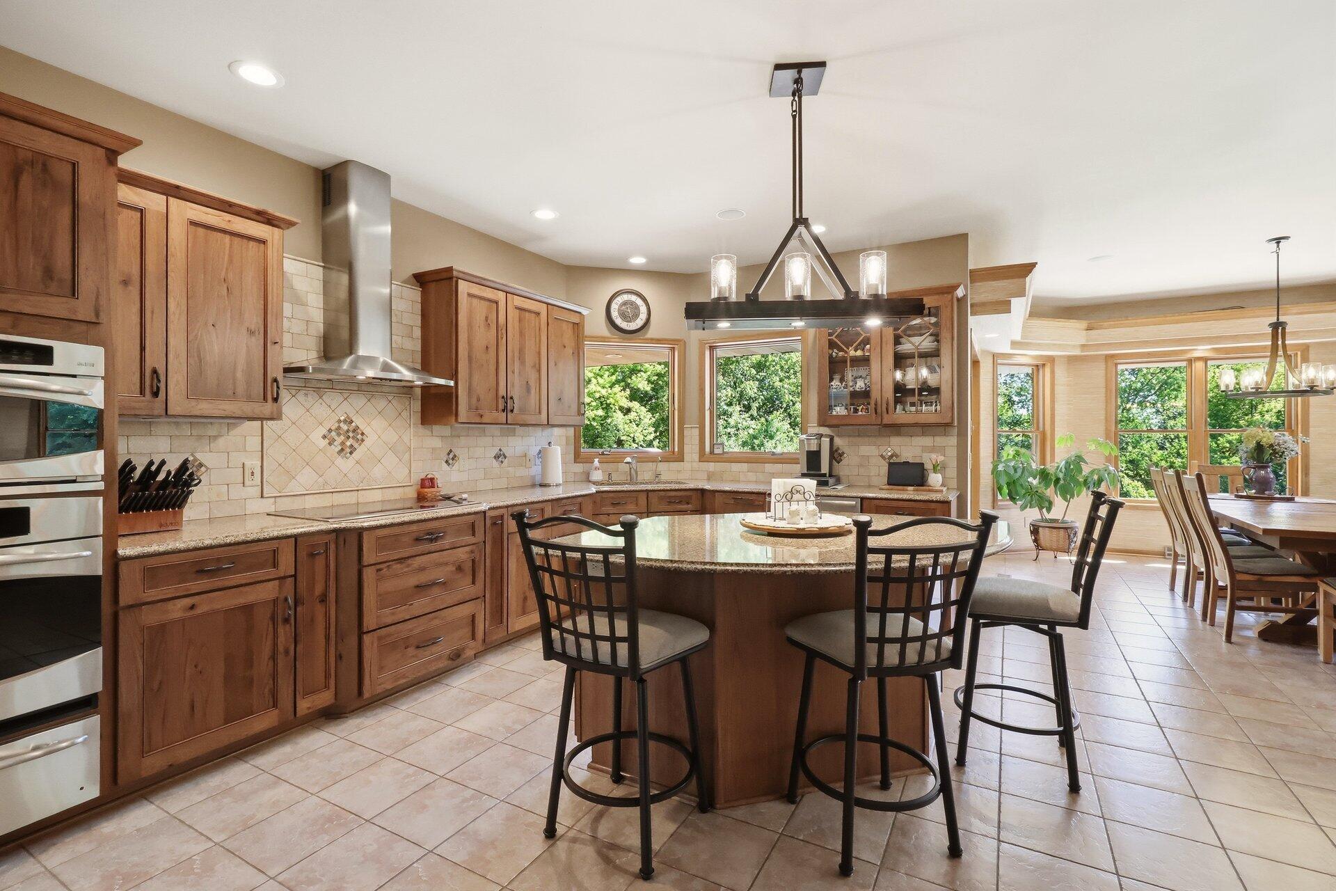 9325 East Six Corners Road Johnstown, WI 53563 - Photo 6 of 42 Kitchen and island