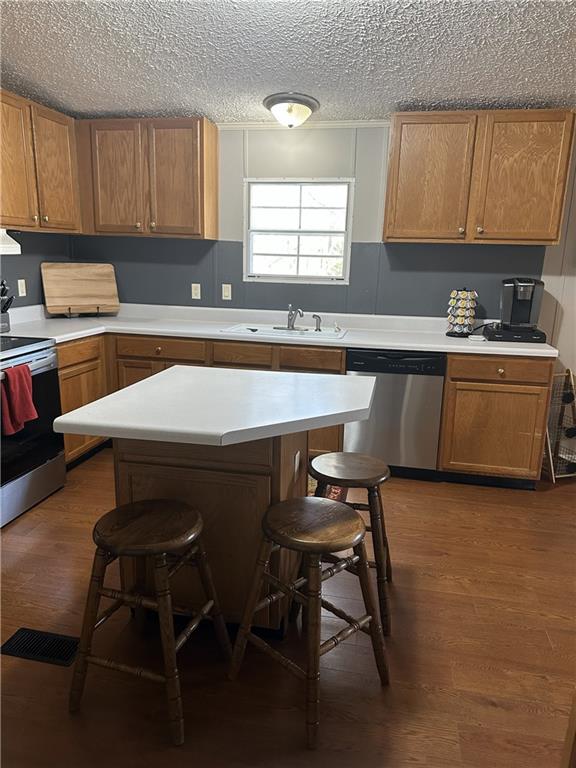 6675 Millwood Road Gainesville, GA 30506 - Photo 5 of 13 a kitchen with a table chairs sink and cabinets