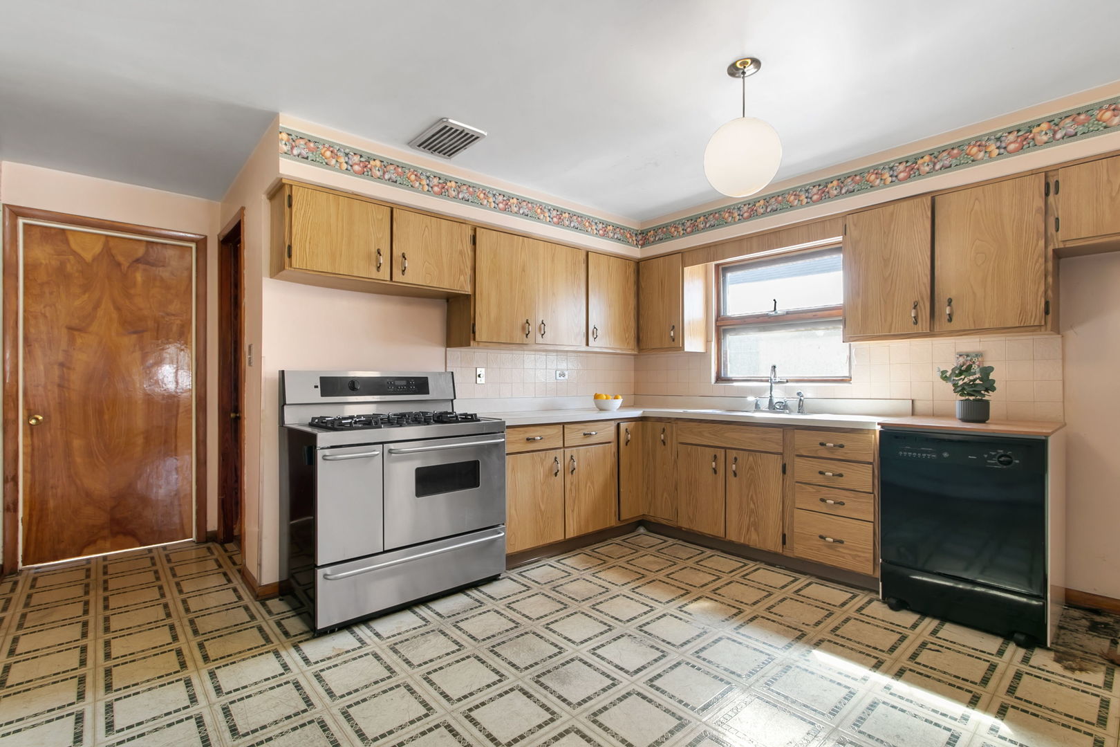 388 Shenstone Road Riverside, IL 60546 - Photo 4 of 29 a kitchen with a sink cabinets and window