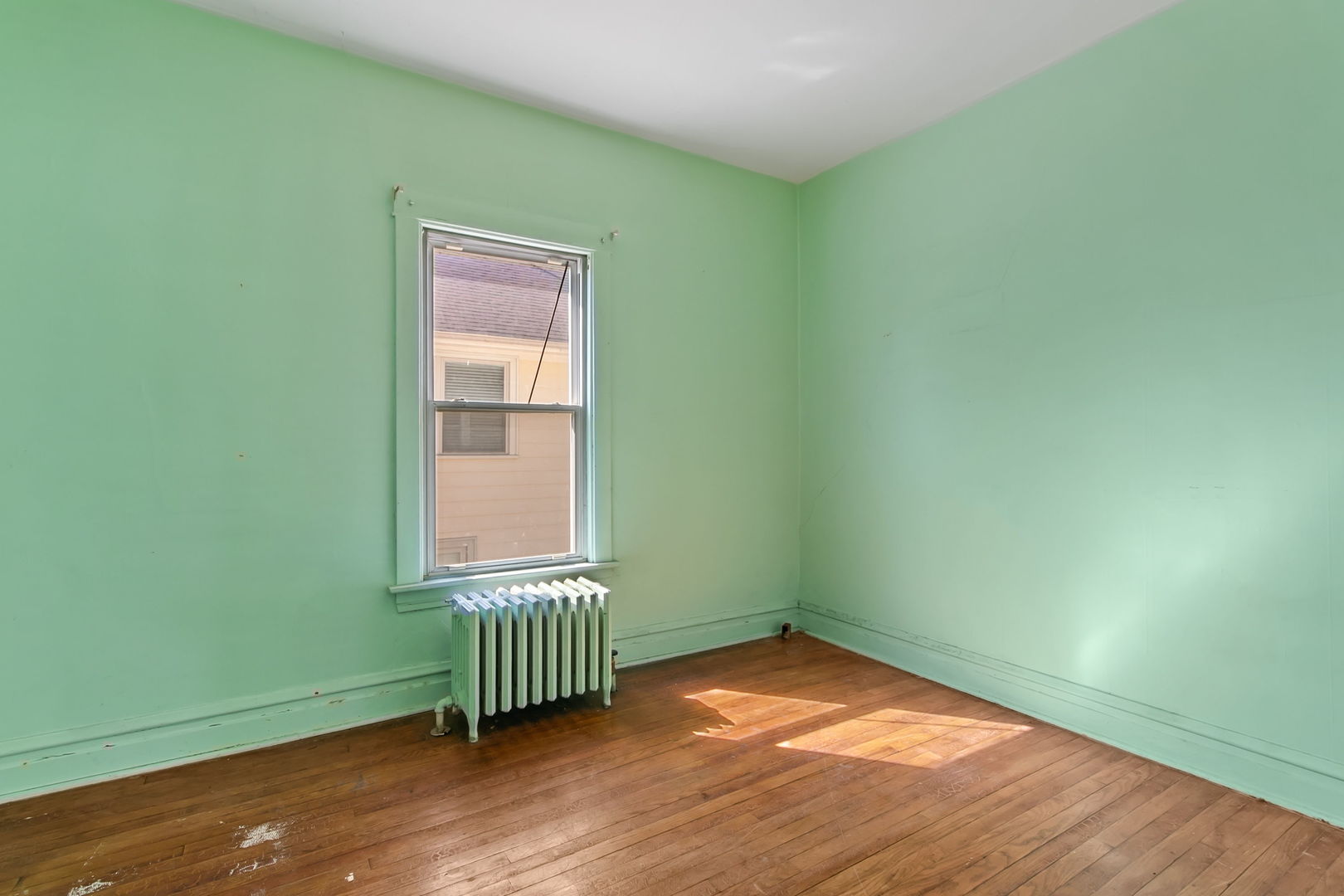 388 Shenstone Road Riverside, IL 60546 - Photo 8 of 29 an empty room with a window and a ceiling fan