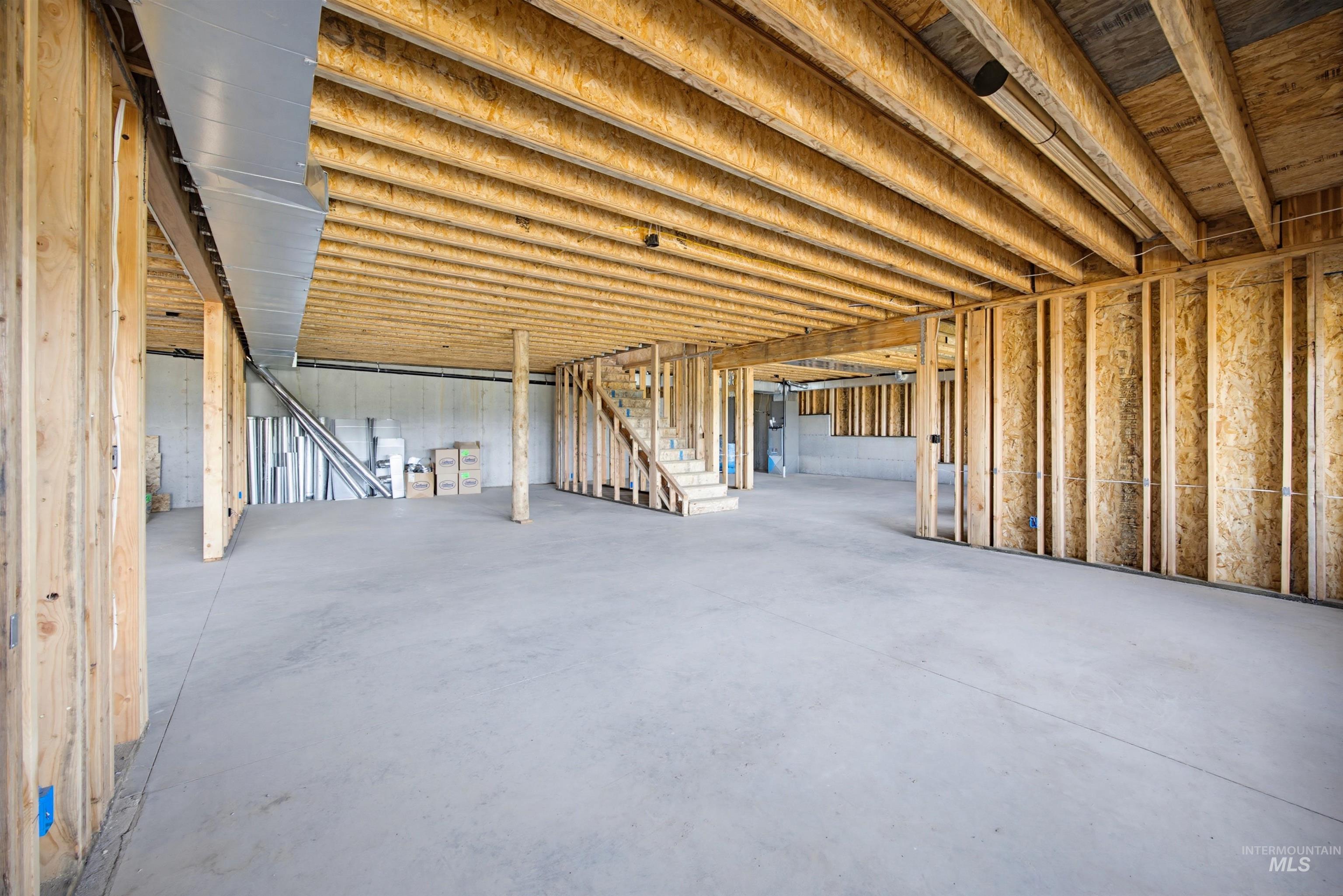 3322 Big Creek Road New Meadows, ID 83654 - Photo 29 of 50 Unfinished basement featuring concrete flooring, exposed wood framing, and wood joists