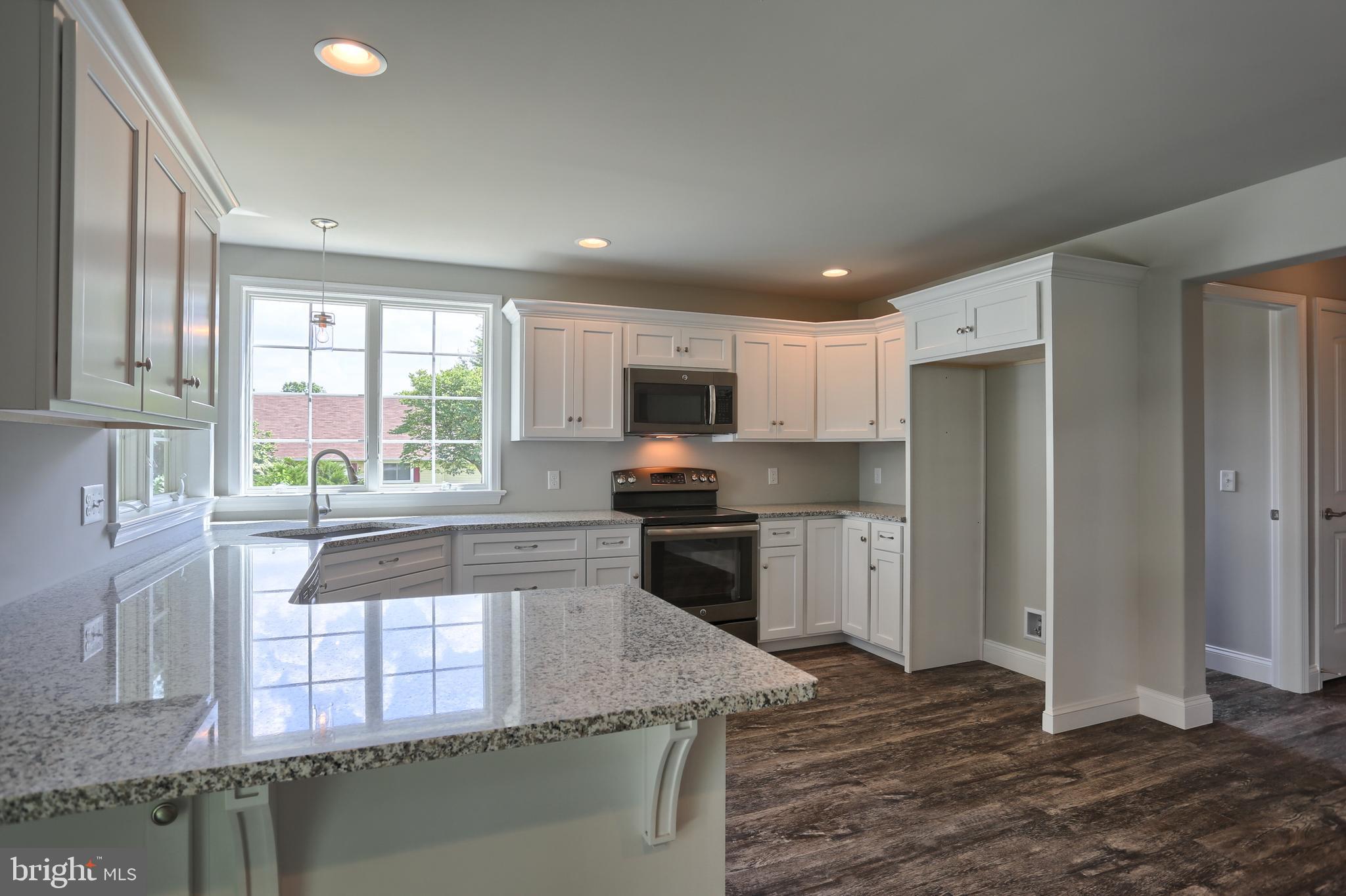 10 Rolling Meadow Road Lebanon, PA 17046 - Photo 11 of 29 a kitchen with stainless steel appliances granite countertop a stove a sink and a refrigerator