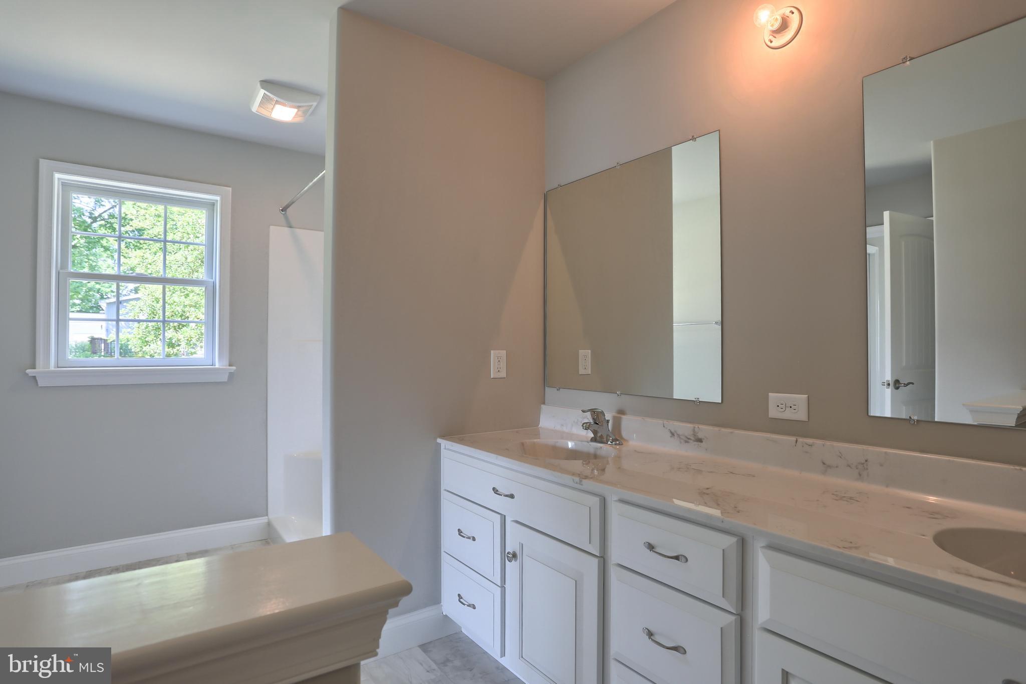 10 Rolling Meadow Road Lebanon, PA 17046 - Photo 21 of 29 a bathroom with a granite countertop tub sink and mirror