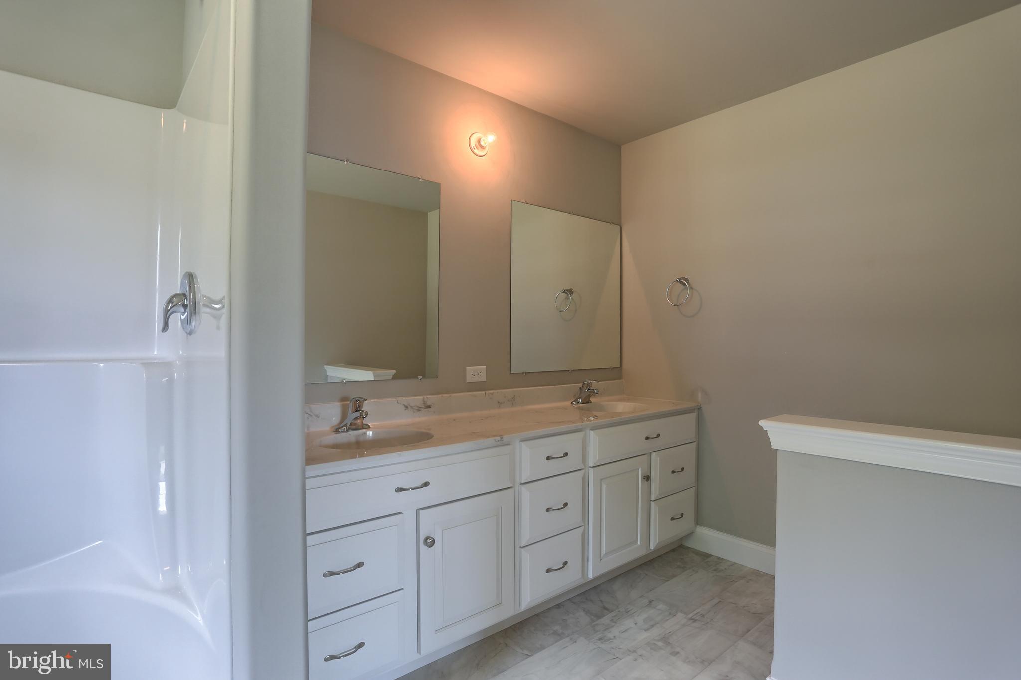 10 Rolling Meadow Road Lebanon, PA 17046 - Photo 22 of 29 a spacious bathroom with a double vanity sink double and mirror