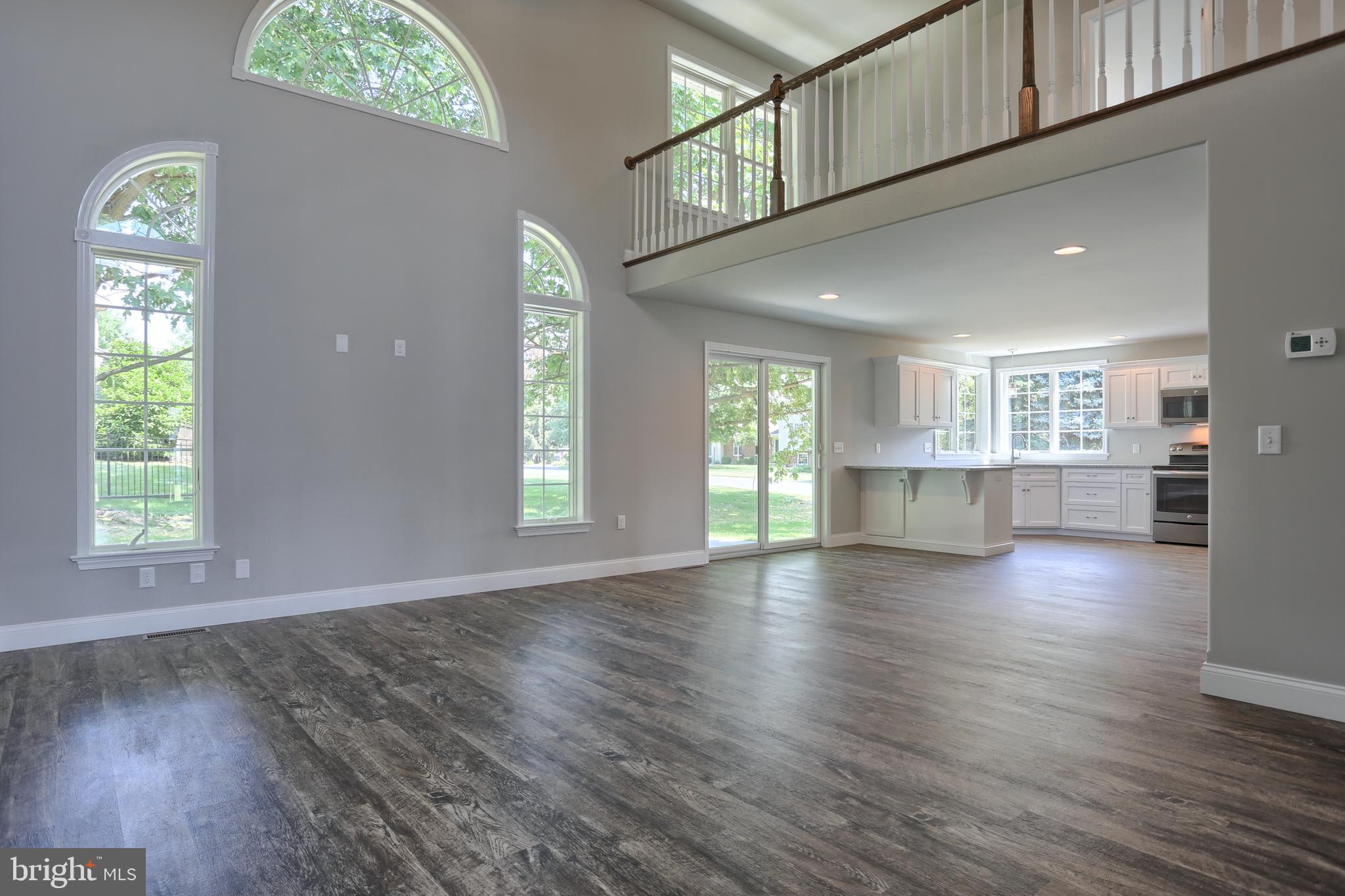 10 Rolling Meadow Road Lebanon, PA 17046 - Photo 6 of 29 a view of an empty room with wooden floor and a window