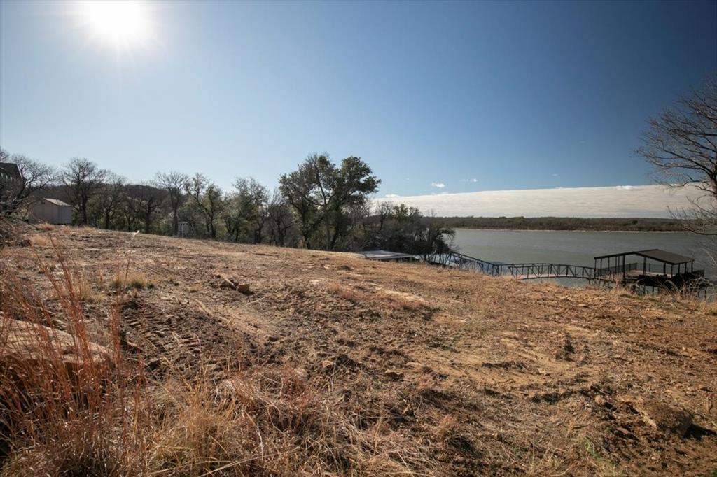 167 Cote D Azur Chico, TX 76431 - Photo 23 of 35 a view of a dry yard with wooden fence