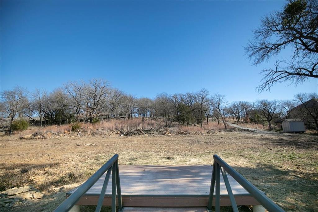 167 Cote D Azur Chico, TX 76431 - Photo 30 of 35 a view of a dry yard with wooden fence