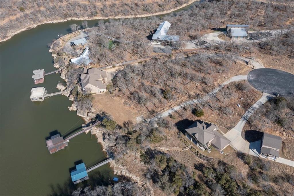 167 Cote D Azur Chico, TX 76431 - Photo 9 of 35 an aerial view of a house with a yard