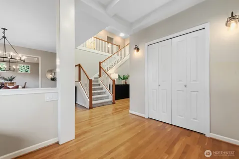 a view of entryway and hall with wooden floor