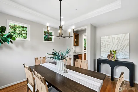a view of a dining room with furniture window and wooden floor