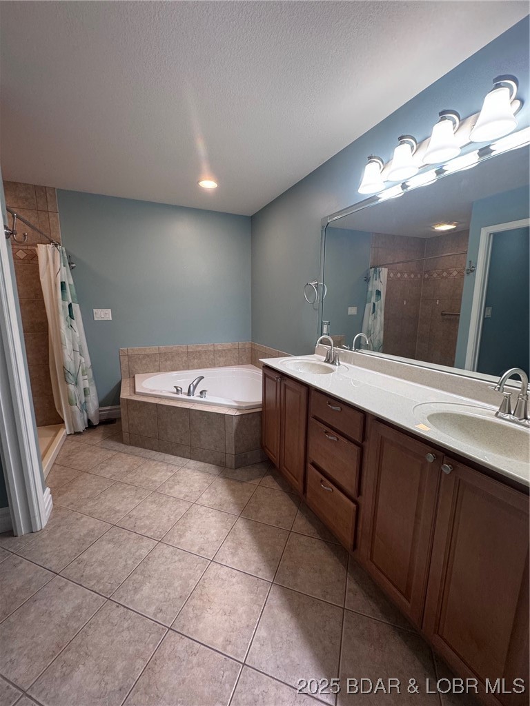 4331 Sunset Drive, Unit B Osage Beach, MO 65065 - Photo 15 of 36 Primary bath-double vanity-oversized framed mirror