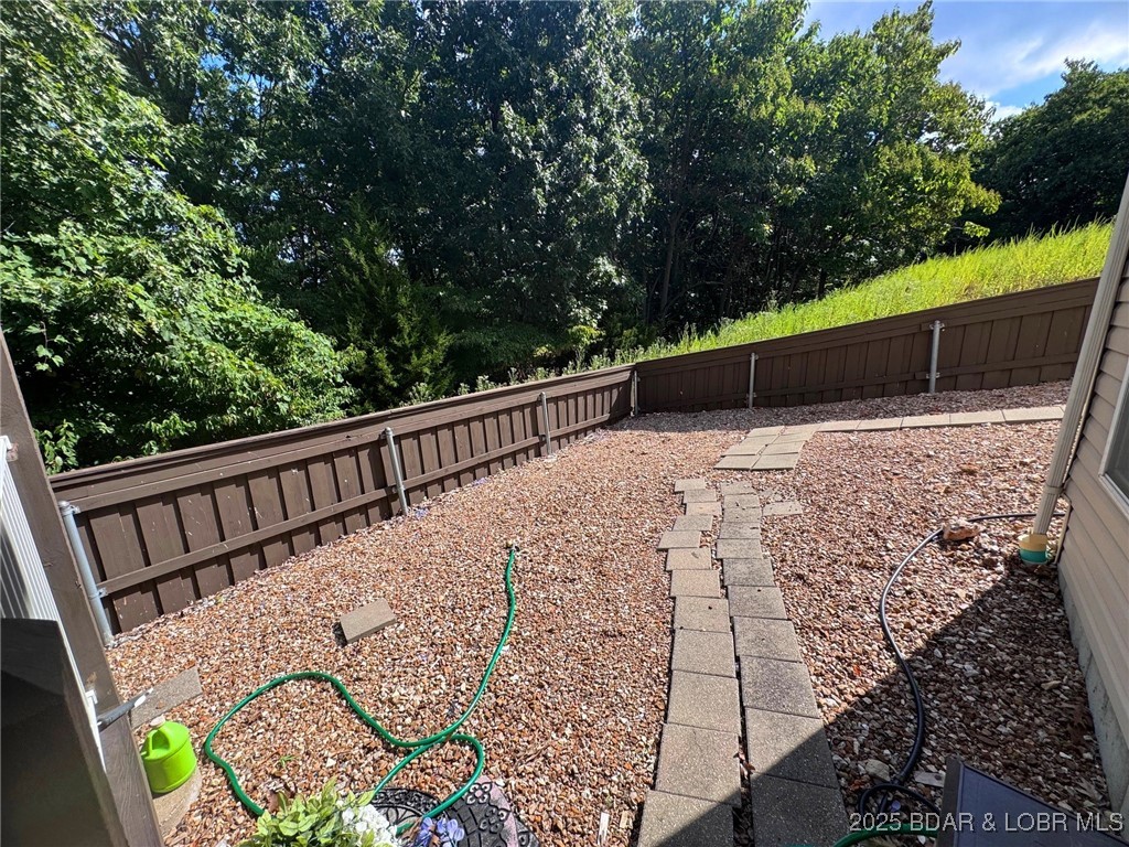 4331 Sunset Drive, Unit B Osage Beach, MO 65065 - Photo 29 of 36 Low maintenance fenced in yard
