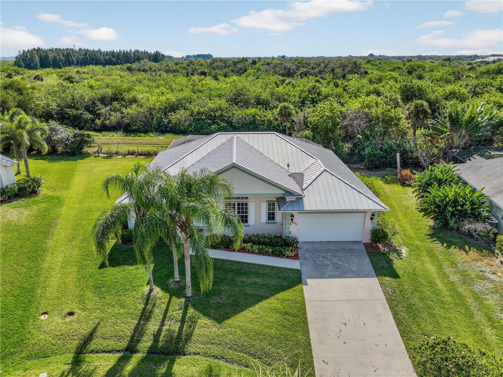 3075 73rd Place Vero Beach, FL 32967 - Photo 23 of 30 an aerial view of a house with a yard