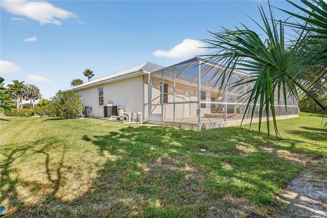 3075 73rd Place Vero Beach, FL 32967 - Photo 25 of 30 a view of a house with a yard