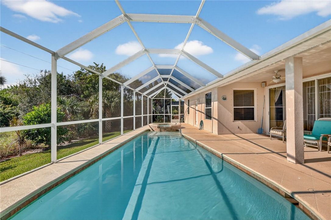 3075 73rd Place Vero Beach, FL 32967 - Photo 27 of 30 a view of swimming pool with glass windows