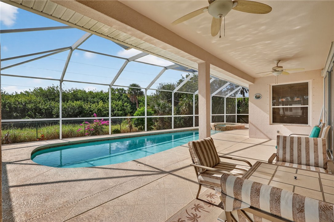 3075 73rd Place Vero Beach, FL 32967 - Photo 29 of 30 a view of a swimming pool with a lounge chairs
