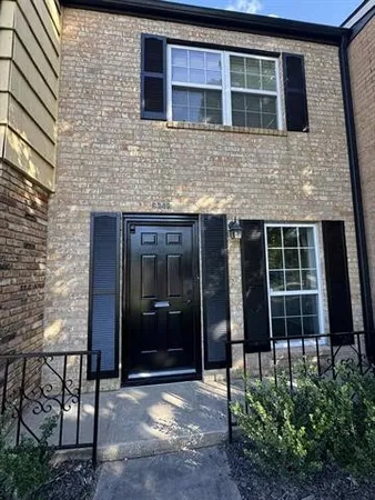 a view of a hallway with washer and dryer