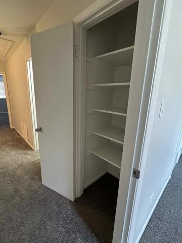 6349 Ivanhoe Lane Beaumont, TX 77706 - Photo 5 of 10 a view of walk in closet with empty racks