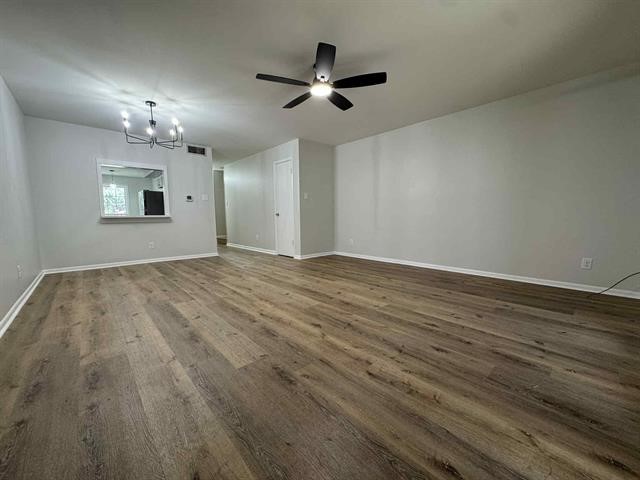 6349 Ivanhoe Lane Beaumont, TX 77706 - Photo 8 of 10 a view of empty room with wooden floor