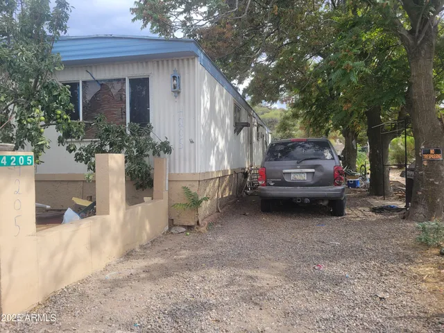 a view of a house with a back yard