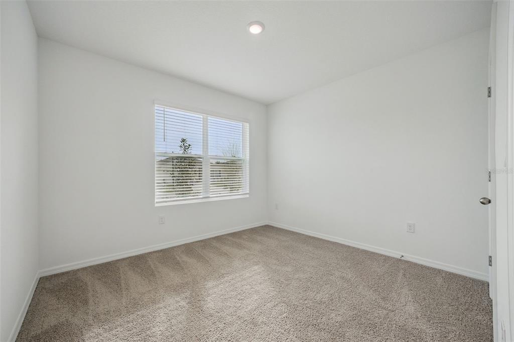 3515 Nettle Loop Tavares, FL 32778 - Photo 15 of 58 a view of an empty room with a window