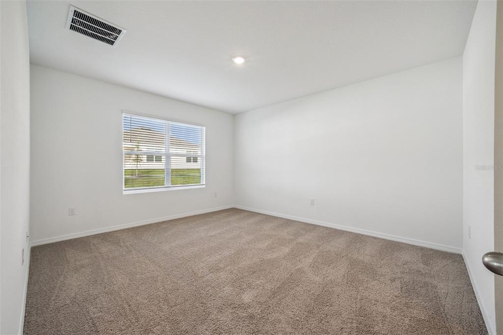 3515 Nettle Loop Tavares, FL 32778 - Photo 18 of 58 an empty room with windows