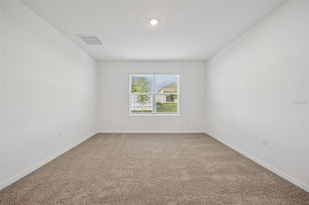 3515 Nettle Loop Tavares, FL 32778 - Photo 19 of 58 an empty room with windows