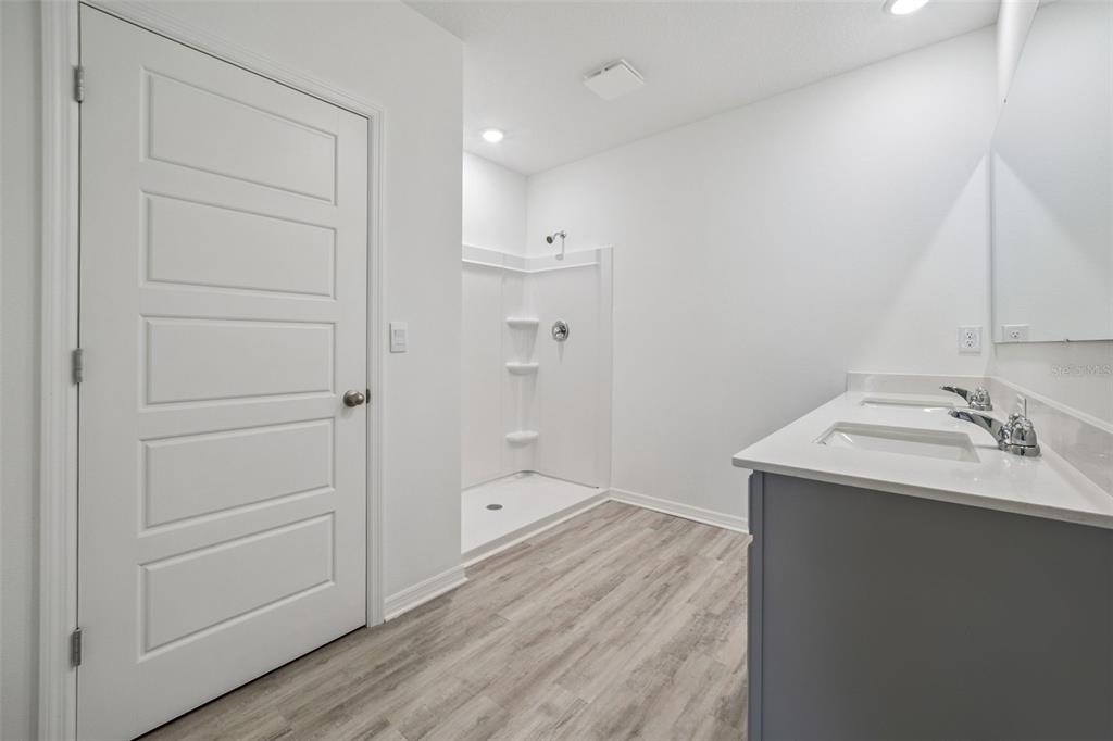 3515 Nettle Loop Tavares, FL 32778 - Photo 24 of 58 a bathroom with a sink and mirror