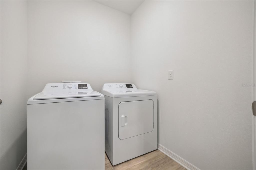 3515 Nettle Loop Tavares, FL 32778 - Photo 26 of 58 a utility room with dryer and washer