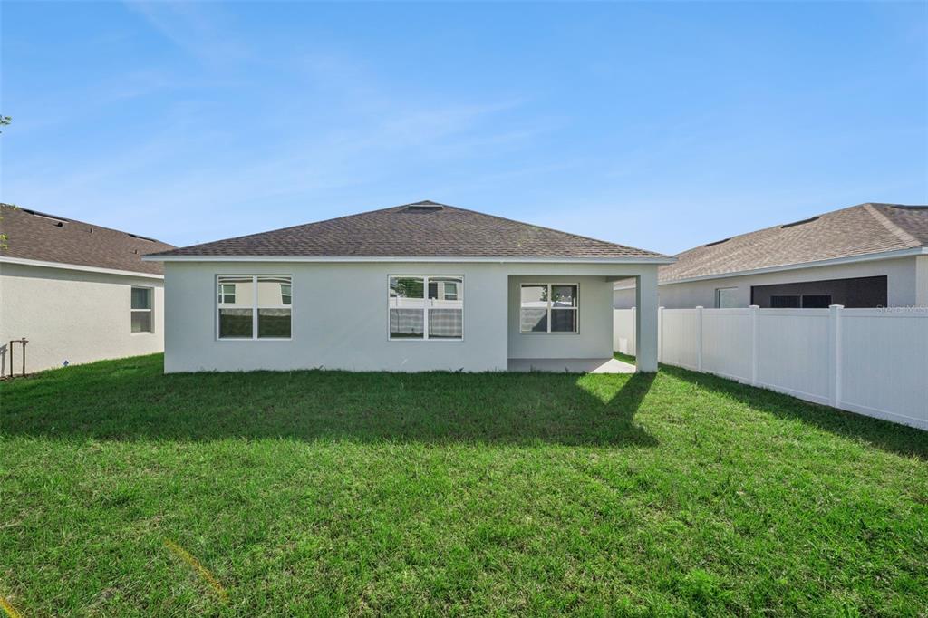 3515 Nettle Loop Tavares, FL 32778 - Photo 30 of 58 a view of a house with a backyard