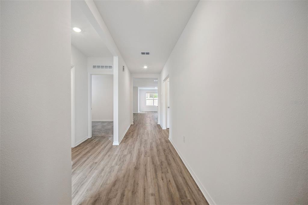 3515 Nettle Loop Tavares, FL 32778 - Photo 3 of 58 a view of hallway with wooden floor