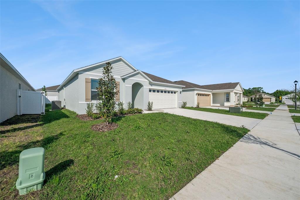 3515 Nettle Loop Tavares, FL 32778 - Photo 32 of 58 a front view of a house with a yard