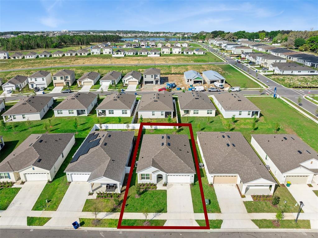 3515 Nettle Loop Tavares, FL 32778 - Photo 35 of 58 an aerial view of residential houses with outdoor space and ocean view