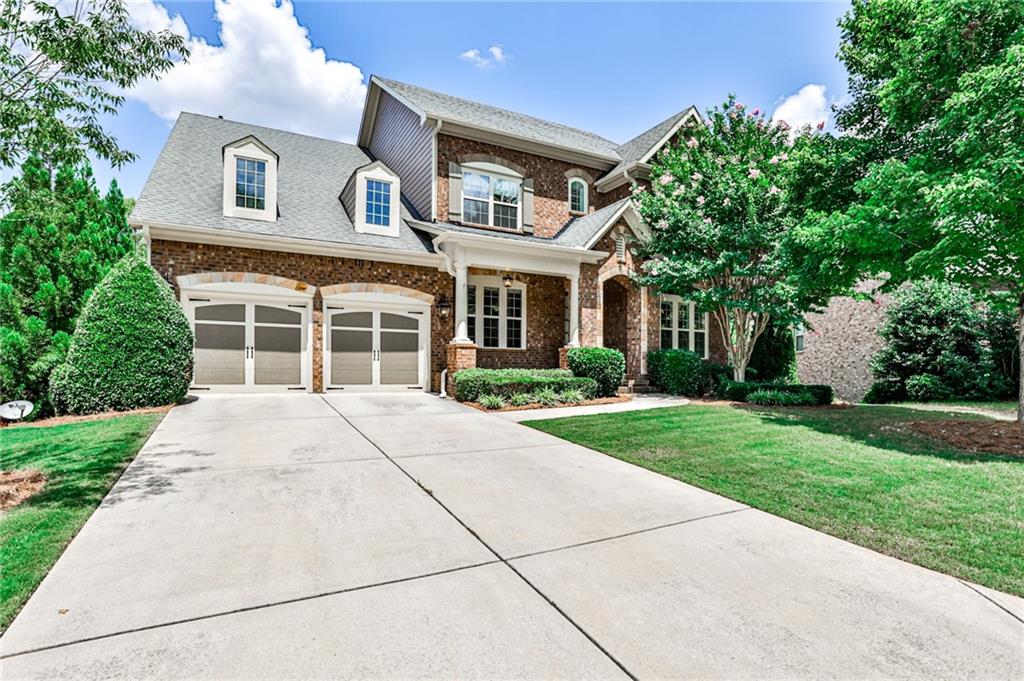 4867 Locklear Way Marietta, GA 30066 - Photo 1 of 1 front view of a house with a yard