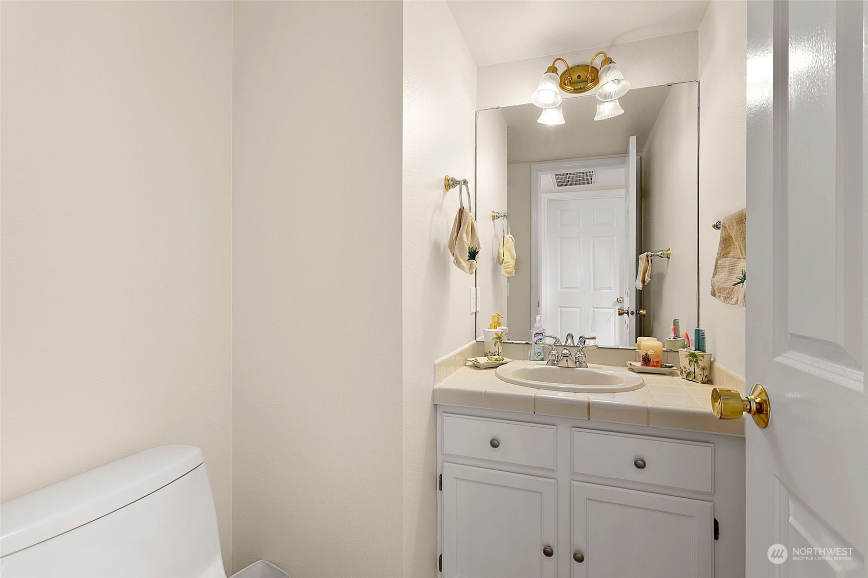 1915 235th Street Southeast Bothell, WA 98021 - Photo 18 of 33 a bathroom with a sink vanity and a mirror