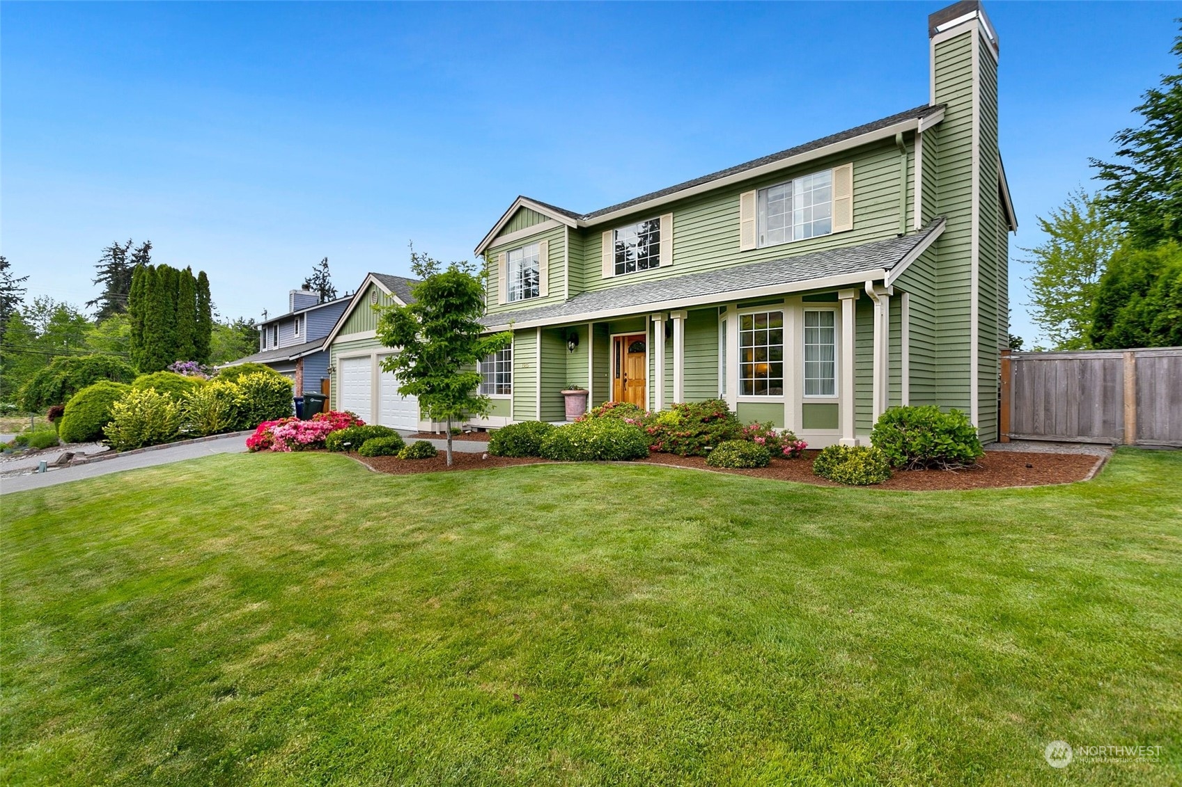 1915 235th Street Southeast Bothell, WA 98021 - Photo 2 of 33 a front view of house with an outdoor space and seating