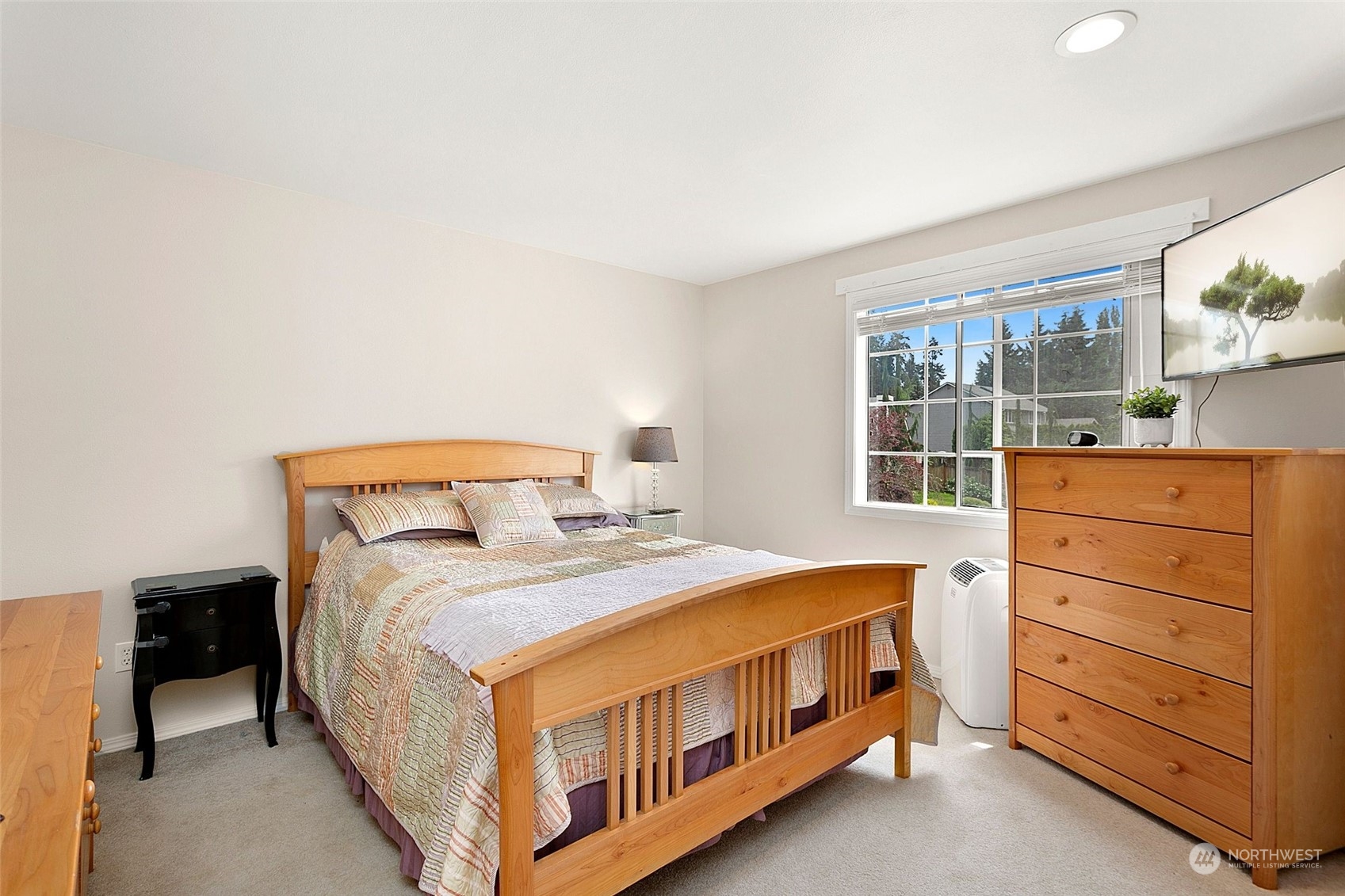 1915 235th Street Southeast Bothell, WA 98021 - Photo 25 of 33 a bed sitting in a bedroom next to a window