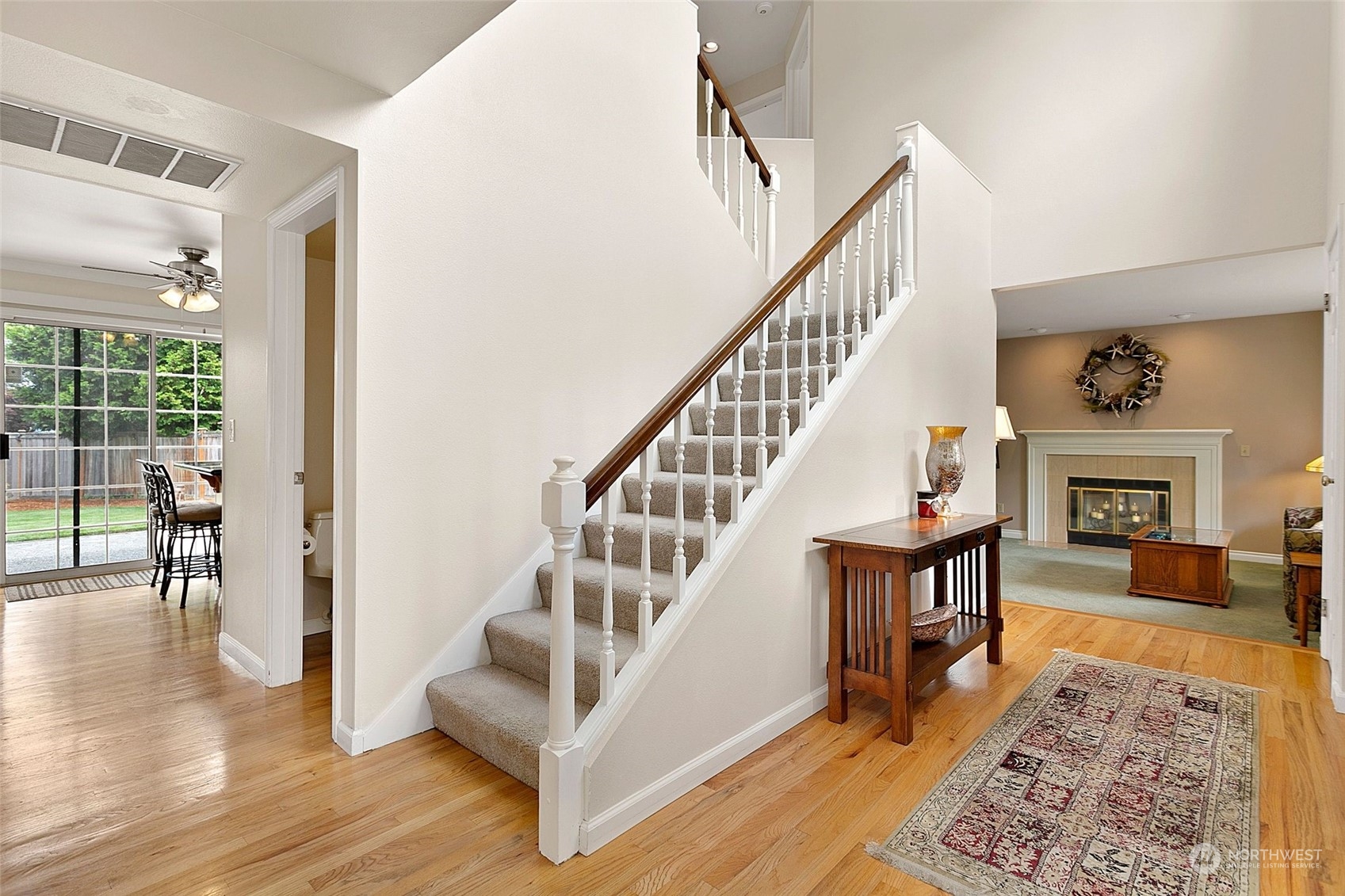 1915 235th Street Southeast Bothell, WA 98021 - Photo 4 of 33 a view of entryway and hall with wooden floor