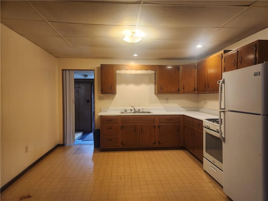 859 Old State Road Apollo, PA 15613 - Photo 3 of 10 a kitchen with granite countertop a refrigerator and a sink