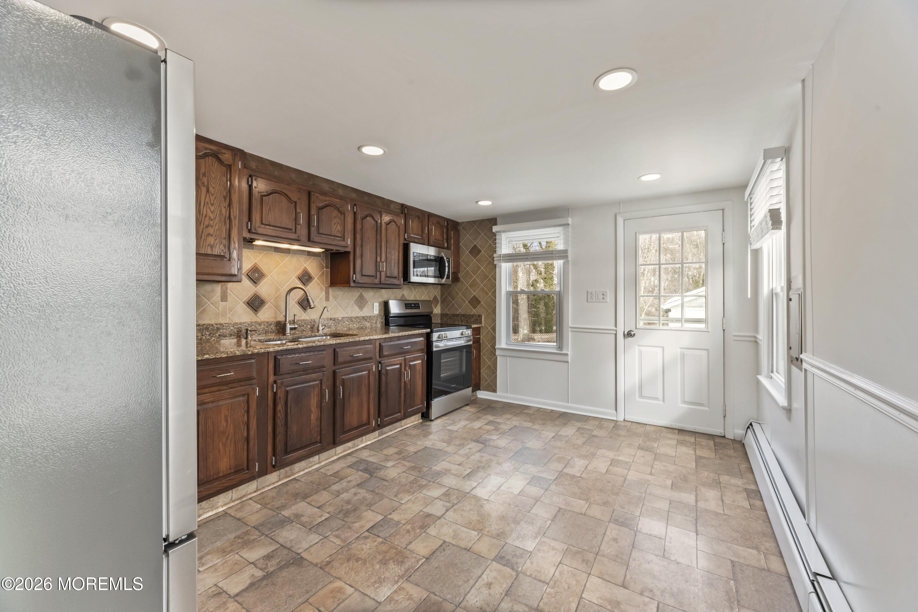 83 Chesterfield Jacobstown Road Wrightstown, NJ 08562 - Photo 13 of 52 a open kitchen with kitchen island granite countertop a refrigerator stove top oven and sink