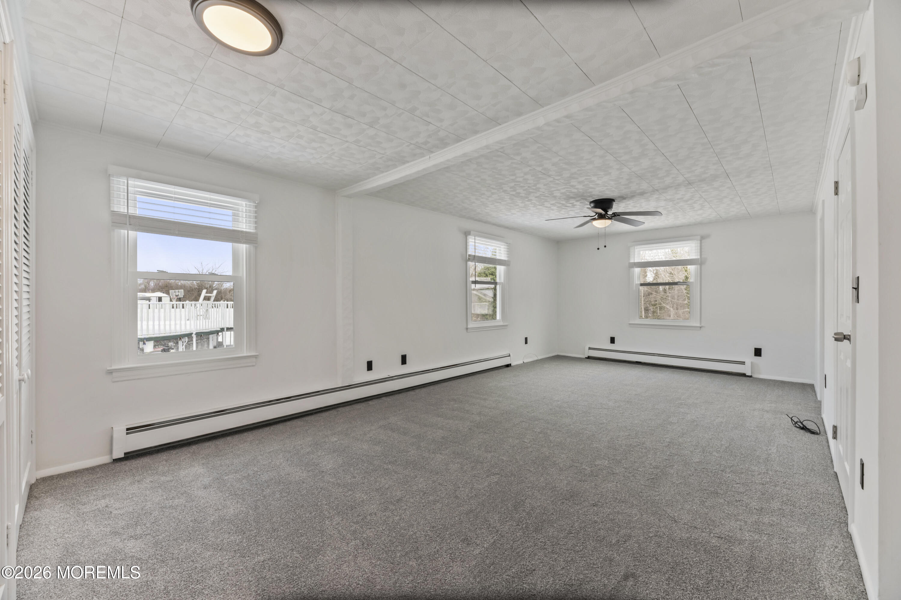 83 Chesterfield Jacobstown Road Wrightstown, NJ 08562 - Photo 16 of 52 an empty room with windows and closet