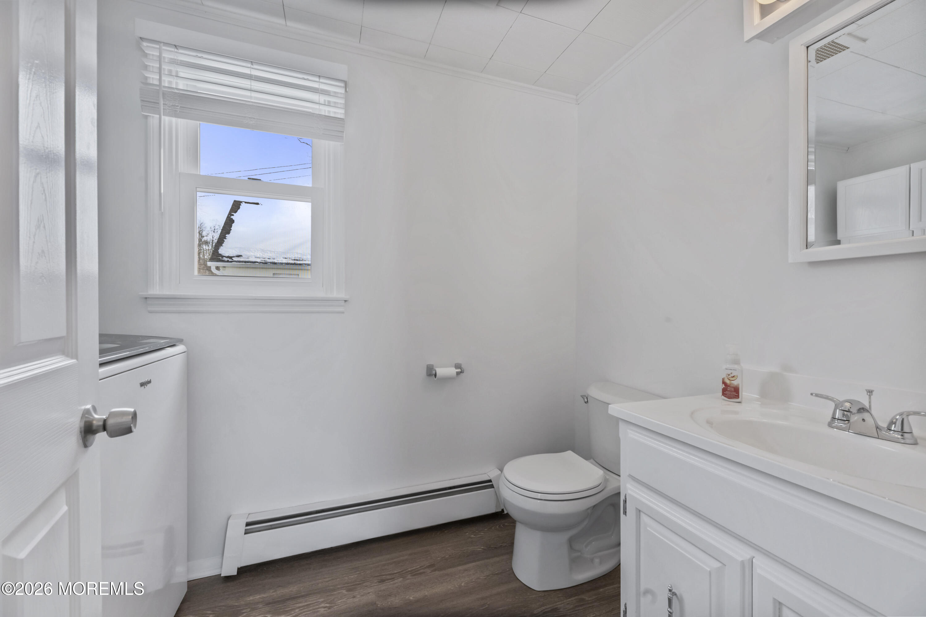 83 Chesterfield Jacobstown Road Wrightstown, NJ 08562 - Photo 23 of 52 a bathroom with a toilet sink vanity and mirror