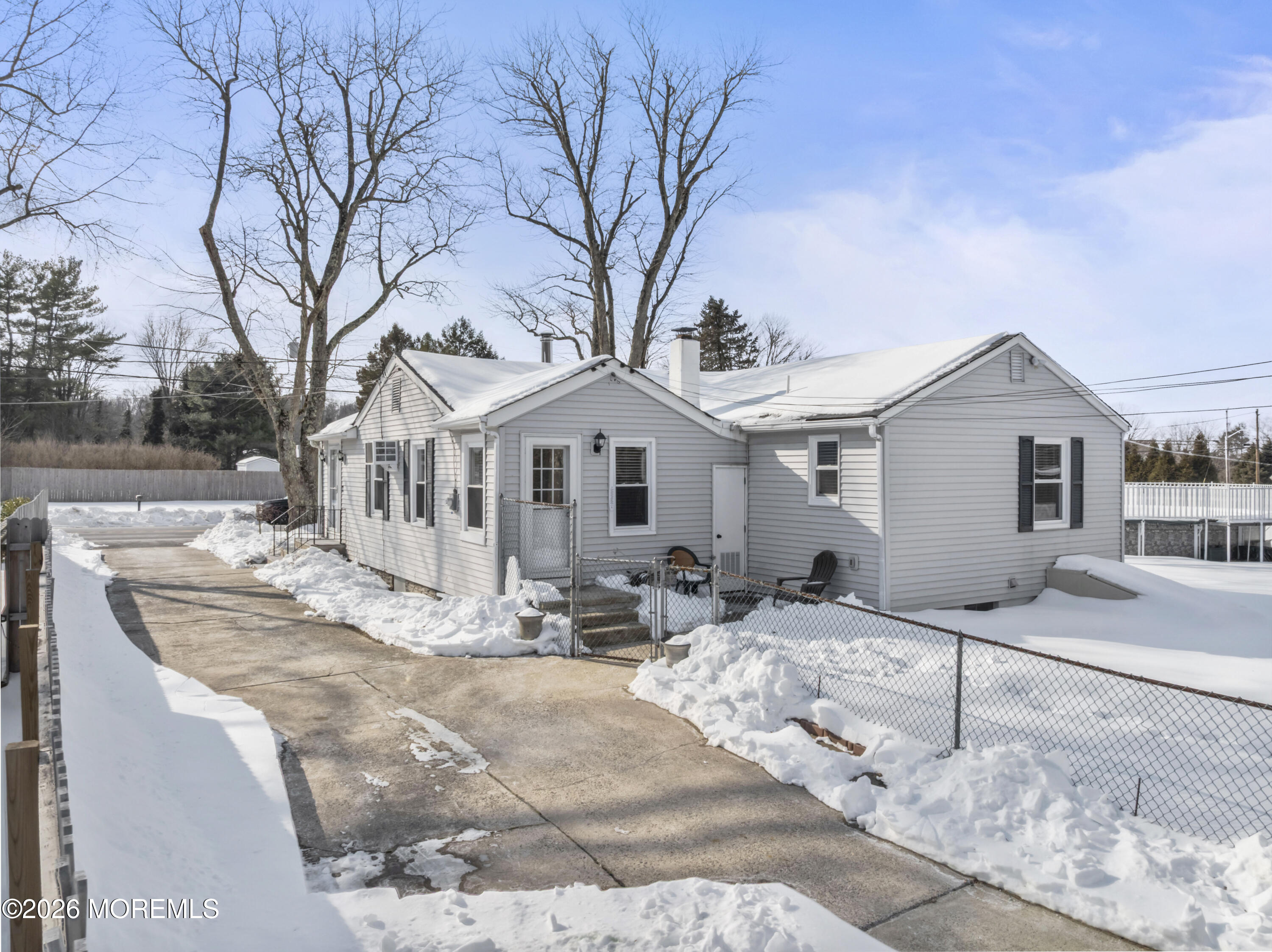83 Chesterfield Jacobstown Road Wrightstown, NJ 08562 - Photo 32 of 52 a view of a white house with wooden fence